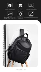 Detailed view of the waterproof fabric and multi-layer storage of the black backpack