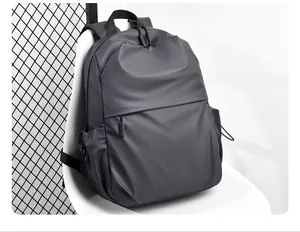 Detailed close-up of dark grey waterproof nylon laptop backpack with hidden zipper design