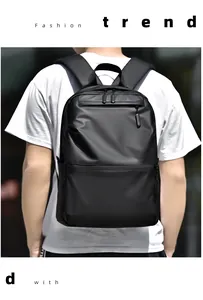 Fashionable minimalist black backpack with wide ergonomic straps shown on model
