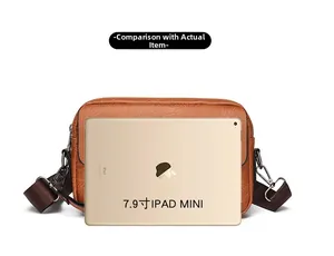 Brown lychee leather messenger bag compared to 7.9 inch iPad Mini for size reference