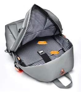 Interior view of grey backpack showing the main pocket and padded laptop compartment
