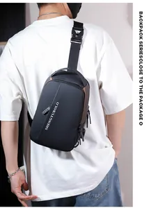Rear view of black waterproof nylon chest bag with adjustable strap on male model