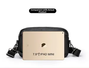 Black pebble leather crossbody bag compared with a 7.9 inch iPad Mini for size scale