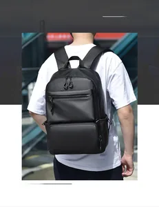 Modern black waterproof travel backpack featuring multiple compartments and ergonomic straps
