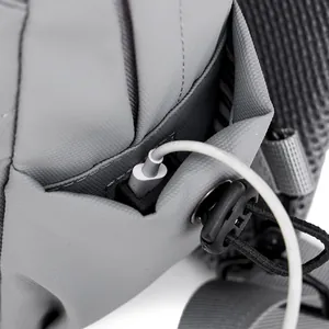 Light grey crossbody bag with integrated USB charging port and textured fabric detail