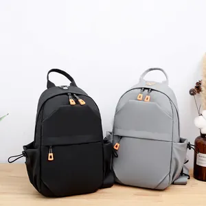Large capacity chest bag in black and gray with orange zipper pulls for outdoor sports