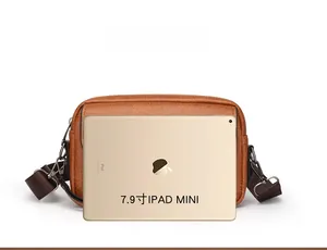 Size comparison of a brown retro crossbody bag shown next to a 7.9-inch iPad Mini