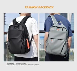 Detail of waterproof backpack side featuring integrated USB charging port for travel