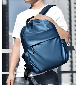 Detail view of water-resistant deep blue commuter backpack with adjustable shoulder straps