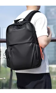Close-up of black waterproof backpack with signature orange zipper ribbon detail