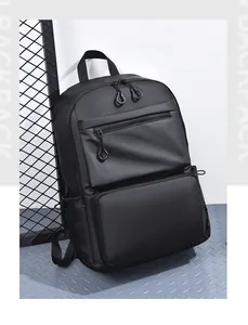 Detail view of the black multi-pocket backpack with dual zippers and side bottle pocket