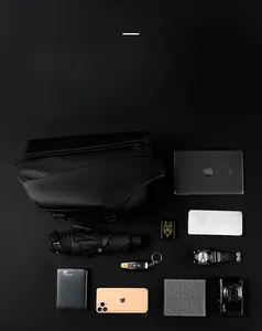 Black tactical crossbody bag flat lay showing large capacity for iPad, camera, and EDC gear