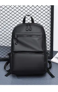 Detail view of water-resistant black backpack with silver zipper and mesh storage