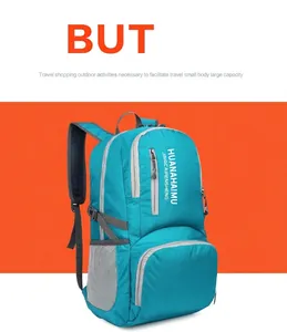 Detail of teal outdoor backpack showing side mesh pocket and gray zipper lining