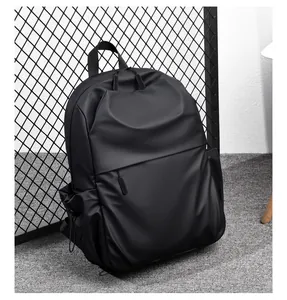 Detail of matte black waterproof backpack with drawstring side pockets and hidden zippers