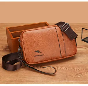 Detailed view of brown PU leather men's satchel on rustic wooden background