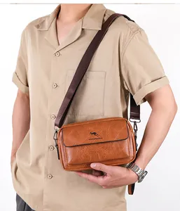 Brown faux leather crossbody bag with adjustable strap worn by male model on white background
