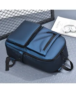 Detail view of water-resistant navy blue nylon business backpack with metal zippers
