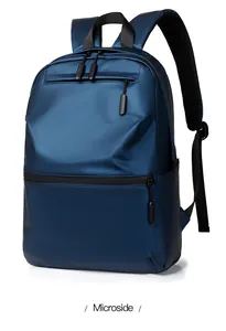 Detailed view of the navy blue waterproof laptop backpack with multiple zipper pockets