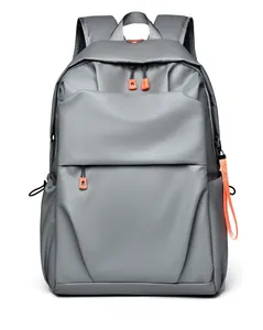 Front detail of gray laptop backpack with orange accents and water-resistant fabric