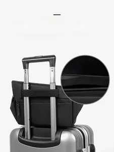 Business travel bag with trolley sleeve secured on luggage handle for easy mobility