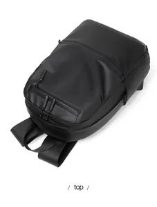 Top view of matte black waterproof business backpack with smooth zippers and padded straps