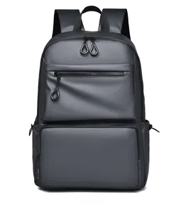 Detailed front view of a dark grey business backpack featuring water-resistant fabric