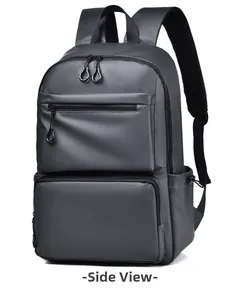 Side view of a dark grey waterproof backpack showing double front zippers and mesh side pocket