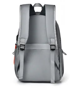 Detail of dark grey backpack featuring padded shoulder straps and USB charging port