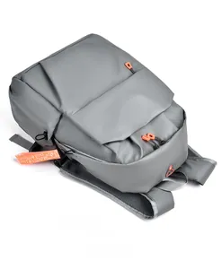 Top view of water-resistant gray laptop backpack with orange zipper accents and mesh straps