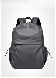 Front view of a dark grey business laptop backpack with matte waterproof fabric details