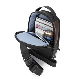 Men's black crossbody chest bag with brown splicing and interior storage display