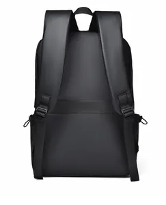 Detailed back view of black business backpack with luggage strap and ergonomic straps