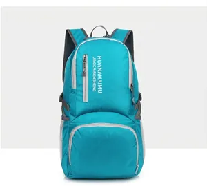 Detailed front view of teal lightweight hiking backpack with side mesh pocket and straps
