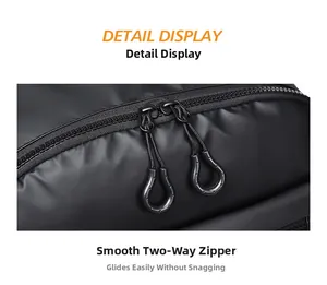 Close-up of durable two-way metal zippers on a black waterproof business backpack