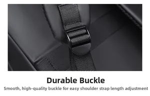 Detail of durable plastic buckle and adjustable nylon strap on a black backpack