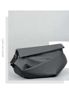 Detail of black waterproof crossbody bag with wide nylon strap and matte texture