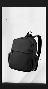 Detailed view of lightweight 0.45kg black water-resistant laptop backpack with side pockets