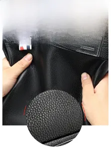 Detail of soft black lychee grain leather briefcase showing durability and texture