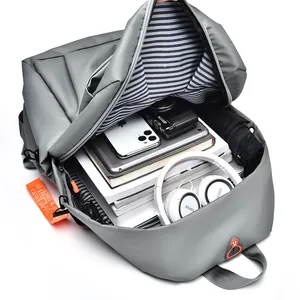 Minimalist grey water-resistant commuter backpack with large capacity and orange strap