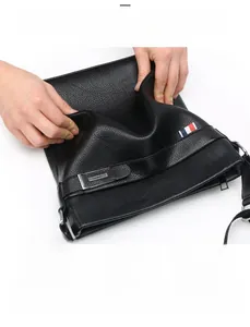 Detail of soft black lychee grain leather briefcase showing flexibility and scratch resistance