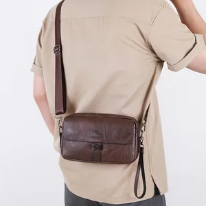 Brown leather crossbody bag for men with adjustable strap and kangaroo embossed logo
