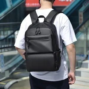 Minimalist black waterproof business backpack with large capacity for travel and laptop
