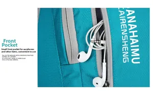 Macro detail of blue waterproof nylon backpack with front zipper pocket and headphones