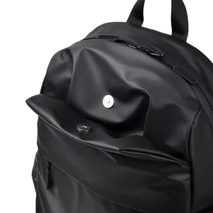 Minimalist black laptop backpack with waterproof matte finish and metal magnetic closure