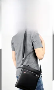 Men's black crossbody bag with litchi texture and signature tri-color stripe detail