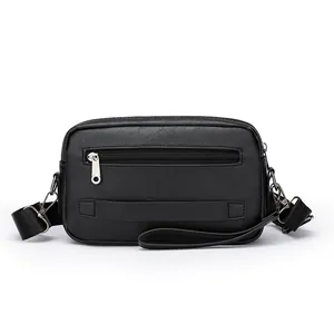 Men's black cross-body bag in premium textured leather with adjustable nylon shoulder strap