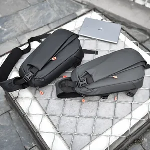 Waterproof street style crossbody chest bag in black and grey with orange zipper accents