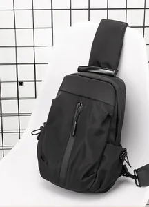 Close-up of black waterproof chest bag with integrated USB charging port for travel