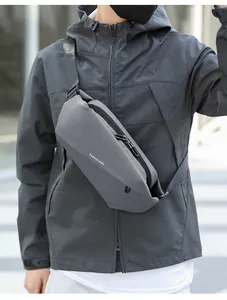 Detail view of water-resistant dark grey crossbody chest bag with adjustable strap